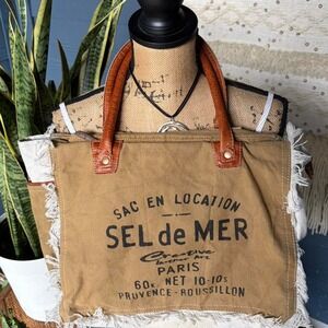Myra Bag Sel De Mer is a shoulder bag constructed from upcycled canvas
